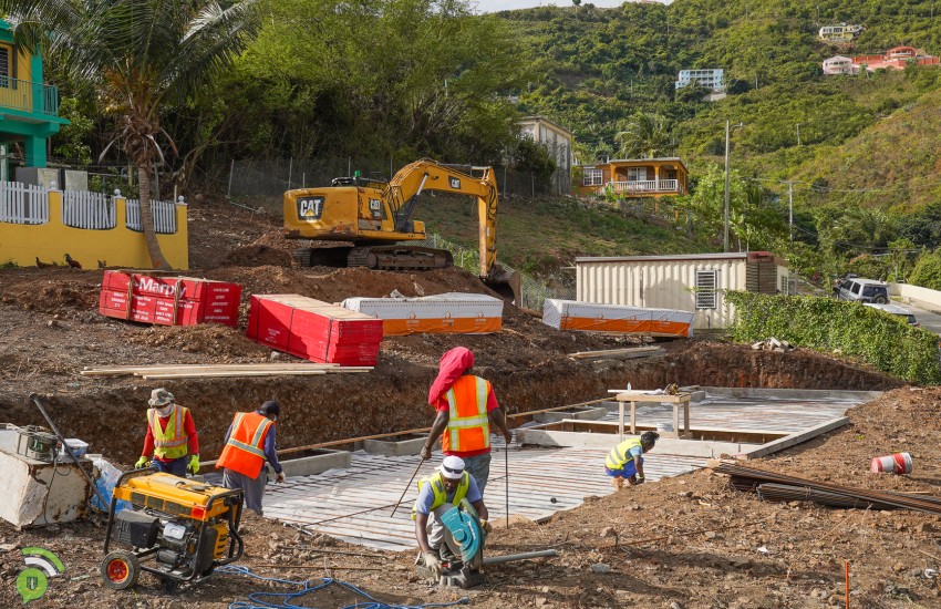 Workers Laying Foundation at Long Look Social Home Complex